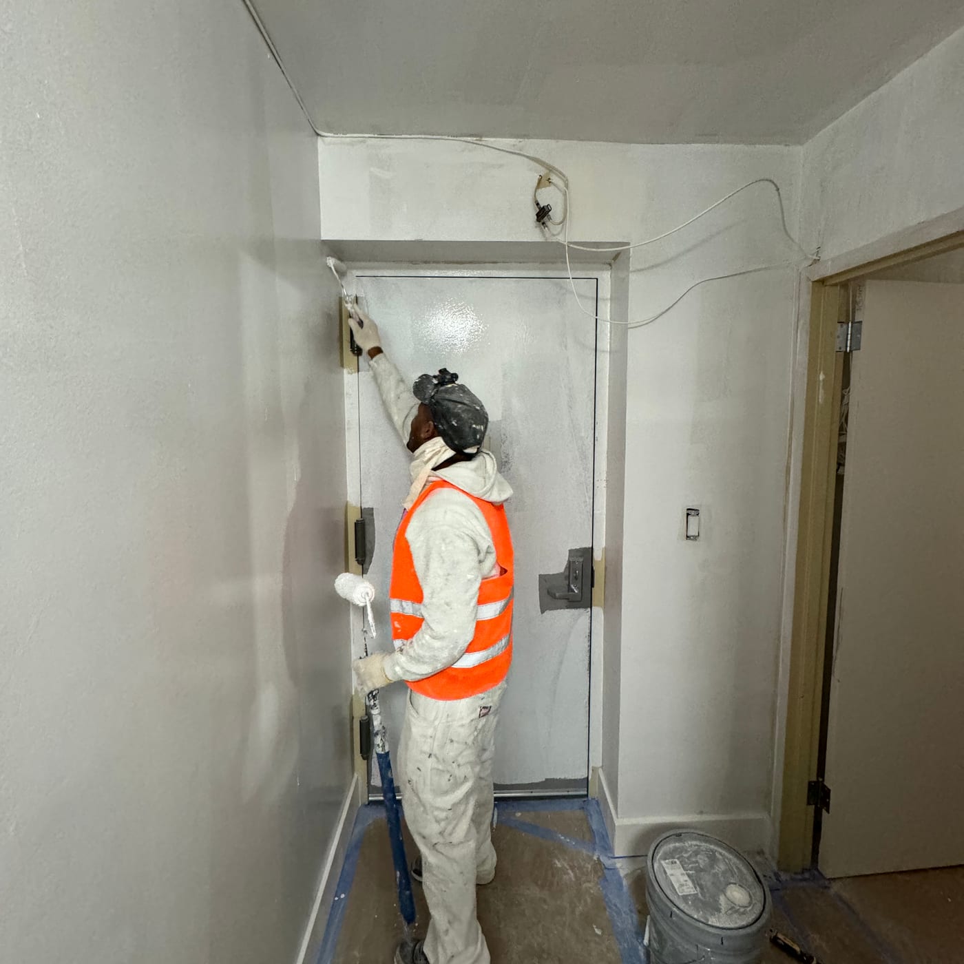 A Perennial Empire painter at work inside an occupied New York City building.